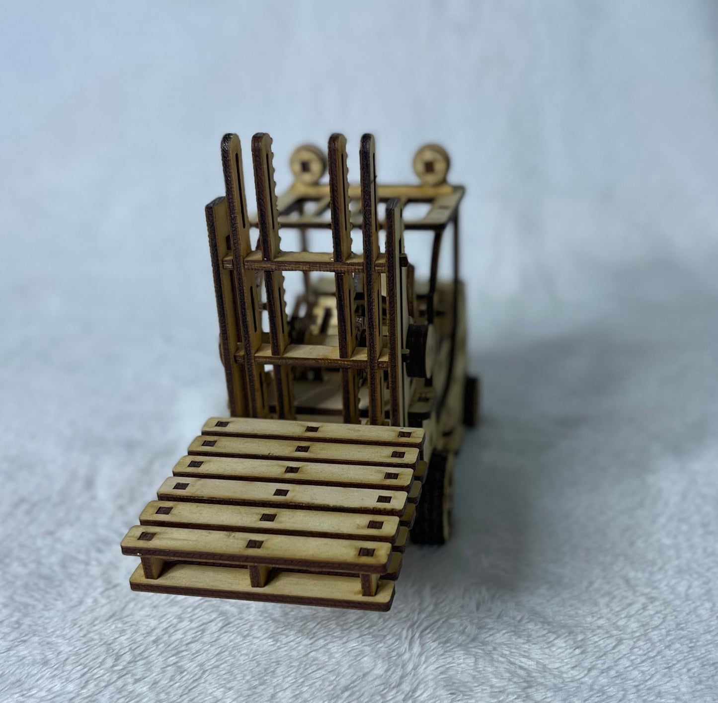 Forklift with 2x Coaster pallets