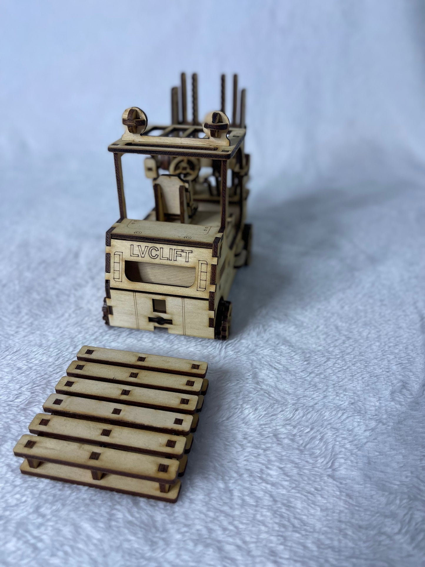 Forklift with 2x Coaster pallets